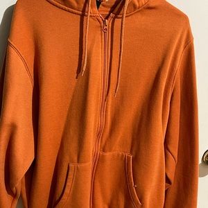 burnt orange zip up jacket with hood